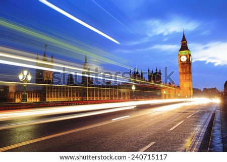 Big Ben and London at night with the lights of the cars passing by after rain, the most prominent symbols of both London and England