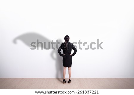 Back view of Superhero business woman look white wall background, great for your design or text, asian