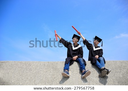 Two happy graduates student look sky and pointing something, asian