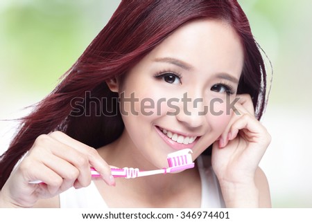 Close up of Smile woman brush teeth. great for health dental care concept, with nature green background. asian