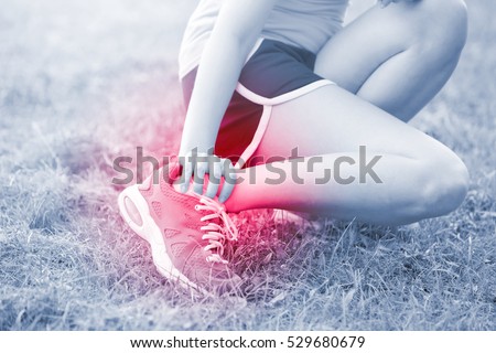 sport woman ankle injury in park, great for your design