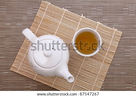 healthful green tea and teapot for afternoon tea time