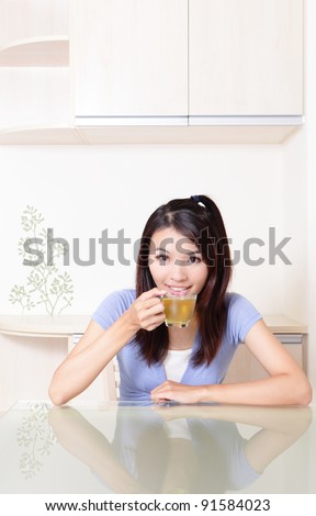 Beauty woman relax drink tea with home background, model is a asian beautiful girl