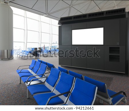 blank billboard and blue chair waiting room at a international airport with busy traveler