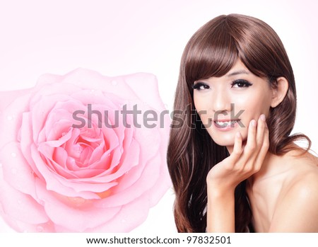 Beautiful Girl smile face close up with pink rose background,model hand touch her face, model is a asian beauty