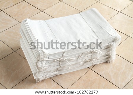 Stack of white canvas sacks