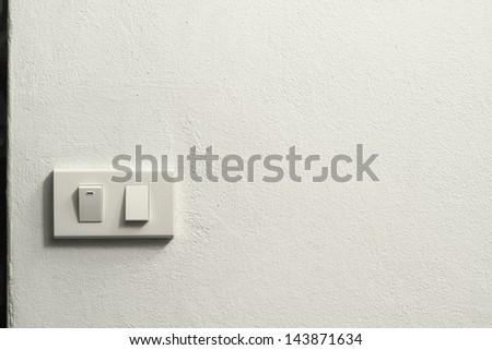 White concrete wall with electric switch