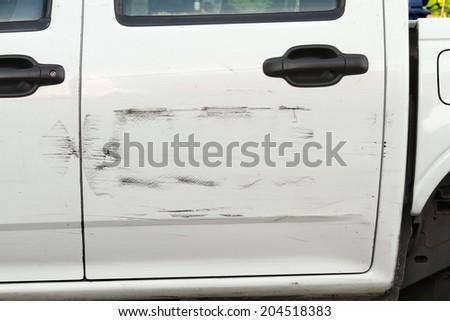 Scratched car paint on an old car