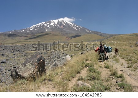 MOUNT AGRI, TURKEY - AUGUST 18: Porters and horses going down to Green Camp, August 18, 2008 in Agri, Turkey. Mount Agri is the highest mountain in Turkey and  believed that Noah Ark is there.