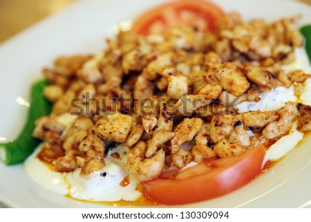 Turkish chicken kebab with yogurt on the dinner plate in Istanbul, Turkey.