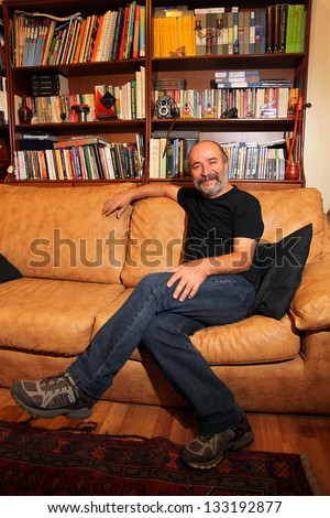 ISTANBUL, TURKEY - AUGUST 22: Famous Turkish filmmaker, scriptwriter and director Reis Celik in their own office at press meeting on August 22, 2012 in Istanbul, Turkey.