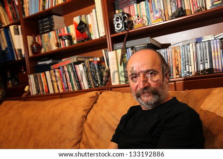ISTANBUL, TURKEY - AUGUST 22: Famous Turkish filmmaker, scriptwriter and director Reis Celik in their own office at press meeting on August 22, 2012 in Istanbul, Turkey.