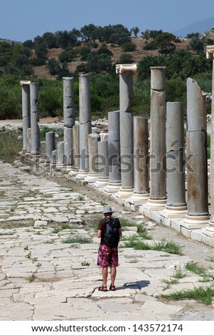 ANTALYA, TURKEY - JUNE 25: Tourist at colonnade street and ruins on June 25, 2012 in Antalya, Turkey. Patara is ancient city in Antalya.
