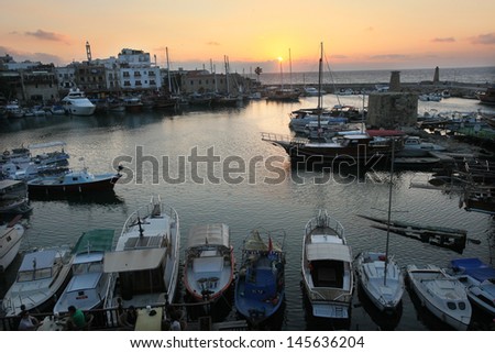 KYRENIA, NORTH CYPRUS - JUNE 17: Boats and yachts at sunset in Kyrenia (Girne) Marina on June 17, 2011 in Kyrenia, North Cyprus. Kyrenia harbor is currently a tourist resort.