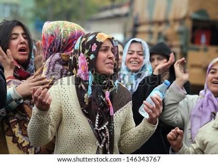 VAN, TURKEY - OCTOBER 25: Turkish women crying and praying in front of our house on October 25, 2011 in Van, Turkey. It is 604 killed and 4152 injured in Van Earthquake.