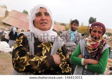 VAN, TURKEY - OCTOBER 25: Earthquake victims Turkish women crying and praying in front of our house on October 25, 2011 in Van, Turkey. It is 604 killed and 4152 injured in Van Earthquake.