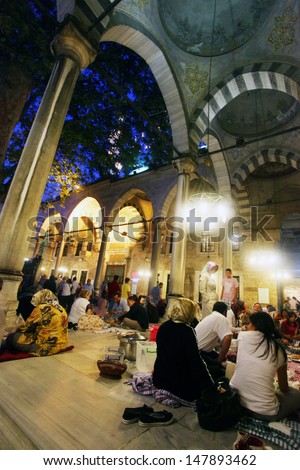 ISTANBUL, TURKEY - AUGUST 8: People praying at Eyup Sultan Mosque at Ramadan on August 8, 2011 in Turkey. Built in 1458, first mosque constructed by the Ottoman Turks in the city.