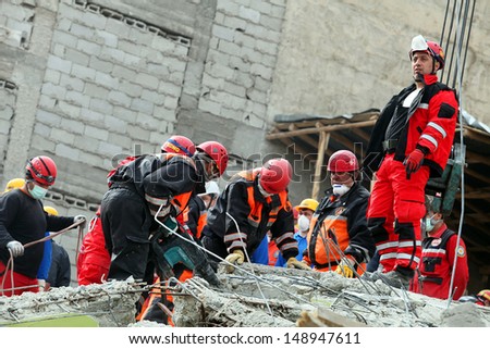 VAN, TURKEY - OCTOBER 25: Rescue team is searching for the wounded under the debris aftter the earthquake on October 25, 2011 in Van, Turkey. It is 604 killed and 4152 injured in Van Earthquake.