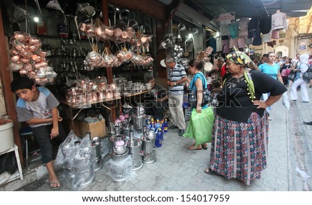 HATAY, TURKEY - AUGUST 21: Old Turkish woman shopping in historical place \'Uzun Carsi\', on August 21, 2011 in Hatay, Turkey. Uzun Carsi is oldest and one of the most important shopping certer in Hatay