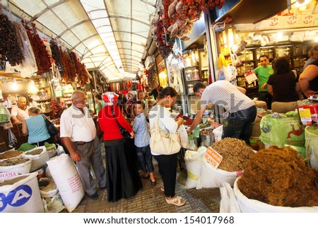 HATAY, TURKEY - AUGUST 21: People shopping at spices market in historical place \'Uzun Carsi\', on August 21, 2011 in Hatay, Turkey. Uzun Carsi is oldest shopping certer in Hatay.