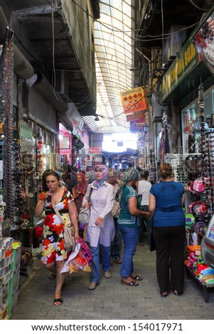 HATAY, TURKEY - AUGUST 21: People walking and shopping in historical place \'Uzun Carsi\' on August 21, 2011 in Hatay, Turkey. Uzun Carsi is oldest and one of the most important shopping certer in Hatay