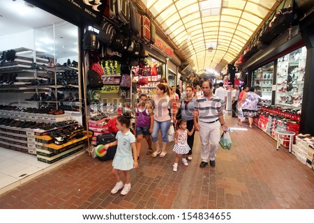 HATAY, TURKEY - AUGUST 21: People walking and shopping in historical place \'Uzun Carsi\' on August 21, 2011 in Hatay, Turkey. Uzun Carsi is oldest and one of the most important shopping certer in Hatay