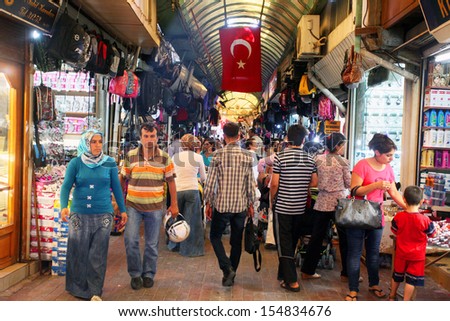HATAY, TURKEY - AUGUST 21: People walking and shopping in historical place 'Uzun Carsi' on August 21, 2011 in Hatay, Turkey. Uzun Carsi is oldest and one of the most important shopping certer in Hatay
