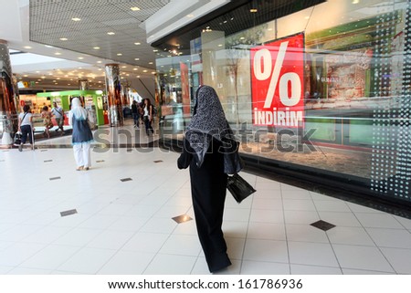 ISTANBUL, TURKEY - JULY 14: Arab tourist walking at shopping mall on July 14, 2011 in Istanbul, Turkey.