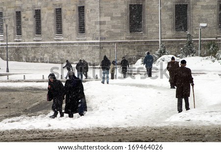 ISTANBUL, TURKEY - JANUARY 23: People trying to go to work on a snowy day in Eminonu District on January 23, 2007 in Istanbul, Turkey.