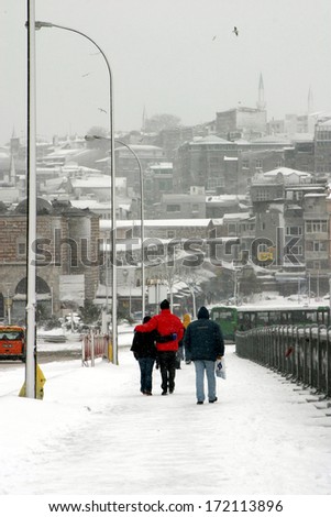 ISTANBUL, TURKEY - JANUARY 23: A snowy day at Galata Bridge in Karakoy Coastline on January 23, 2007 in Istanbul, Turkey.