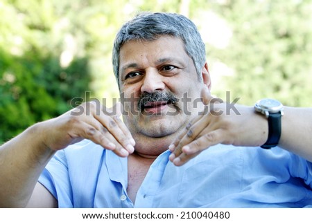ISTANBUL, TURKEY - JULY 7: Turkish actor, politician, pop singer and tv series producer Osman Yagmurdereli portrait on July 7, 2007 in Istanbul, Turkey. He died 1 August 2008.
