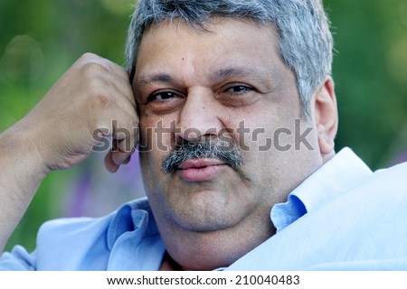 ISTANBUL, TURKEY - JULY 7: Turkish actor, politician, pop singer and tv series producer Osman Yagmurdereli portrait on July 7, 2007 in Istanbul, Turkey. He died 1 August 2008.