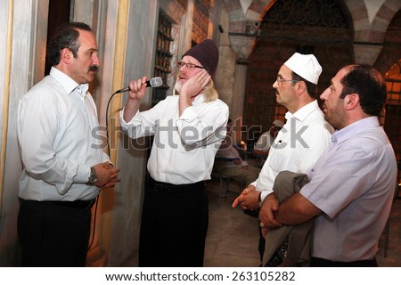 ISTANBUL, TURKEY - JUNE 23: Mosque preachers praying at Ramadan night in Validei Atik Mosque on June 23, 2013 in Istanbul, Turkey.