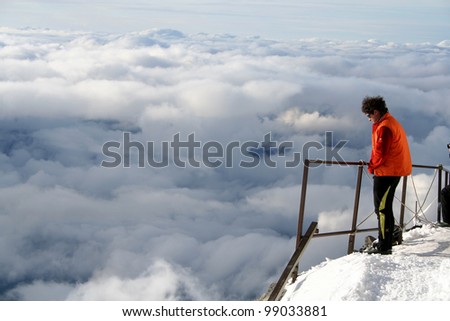 MONT BLANC, FRANCE - AUGUST 27: Mountaineer, watching clouds in Gouter mountain house on August 27, 2006 in Chamonix, France. Gouter mountain house at 3817 meters.