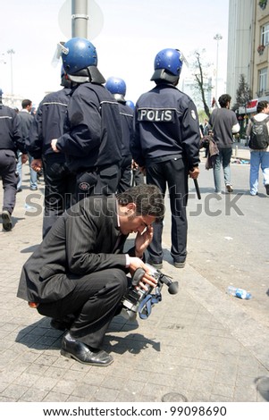 ISTANBUL, TURKEY - MAY 1: International Workers Day. A man faint to tear gas on May 1, 2007 in Istanbul, Turkey. Taksim Square is the center of the protest and celebrations.