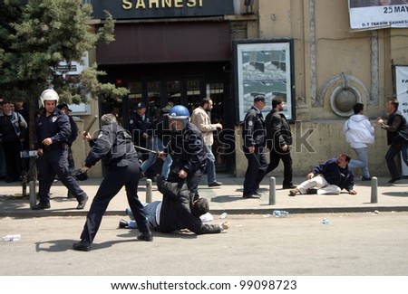 ISTANBUL, TURKEY - MAY 1: International Workers Day. Turkish Police Officers are detenting protester on May 1, 2007 in Istanbul, Turkey. Taksim Square is the center of the protest and celebrations.