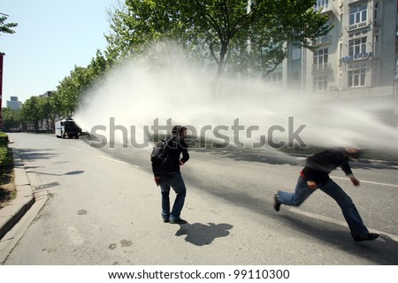 ISTANBUL, TURKEY - MAY 1: International Workers Day. Police throwing pressurized water at protesters on May 1, 2008 in Istanbul, Turkey. Taksim Square is the center of the protest and celebrations.
