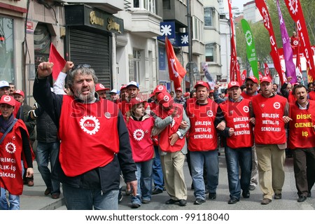 ISTANBUL, TURKEY - MAY 1: International Workers Day. Workers and socialist group walks in Istiklal Street on May 1, 2009 in Istanbul, Turkey. The event attracted thousands of labor protesters.