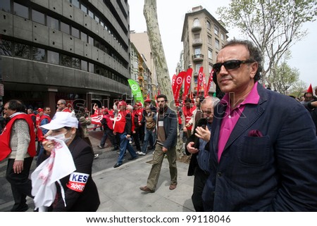 ISTANBUL, TURKEY - MAY 1: International Workers Day. Workers and parliamentarian Sirri Sakik walks in Istiklal Street on May 1, 2009 in Istanbul, Turkey. Event attracted thousands of labor protesters.