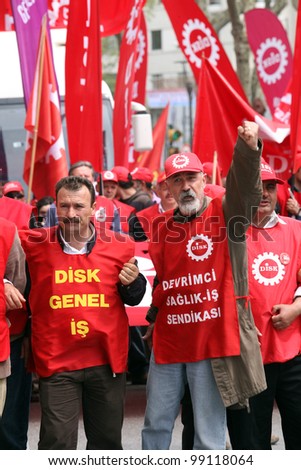 ISTANBUL, TURKEY - MAY 1: International Workers Day. Workers and socialist group walks in Istiklal Street on May 1, 2009 in Istanbul, Turkey. The event attracted thousands of labor protesters.
