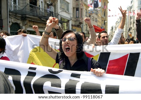 ISTANBUL, TURKEY - MAY 1: International Workers Day. Workers and socialist group walks in Istiklal Street on May 1, 2007 in Istanbul, Turkey. The event attracted thousands of labor protesters.