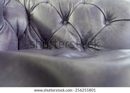 Purple leather sofa texture background; Close up