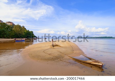 Sank fishing boat on a tropical beach in Thailand