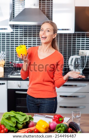Diet. Happy Young Woman with Fresh Vegetables at the kitchen. Healthy food. Dieting concept. Vegan. Vegetarian Food