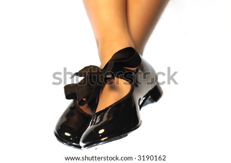 girl\'s wearing tap dance shoes