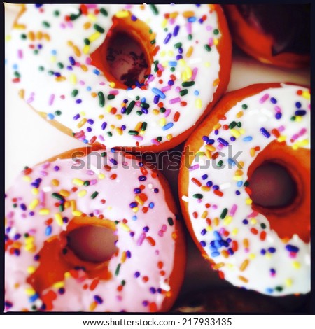 close up image of color donuts in a box