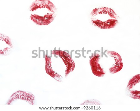 Random red kisses on a white background