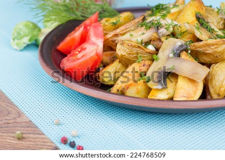 Dish of baked potato slices with mushrooms and herbs