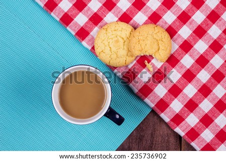 Cup of coffee and cookies on the table. Snack biscuits and coffee with milk.