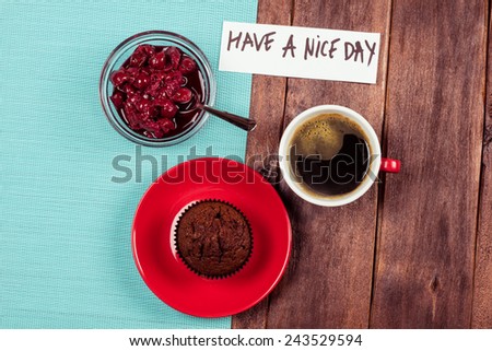 Cup of black coffee, cherry jam and chocolate cake on the table. Light breakfast or lunch, wish of nice day. Strong coffee and pastries on the table. Good Morning